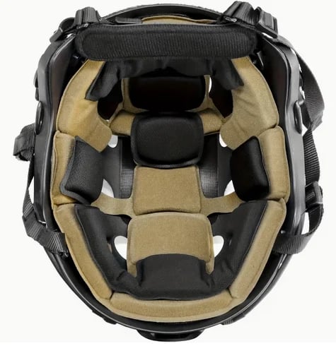 Interior view of a black and tan motorcycle helmet showing padded compartments and ventilation channels